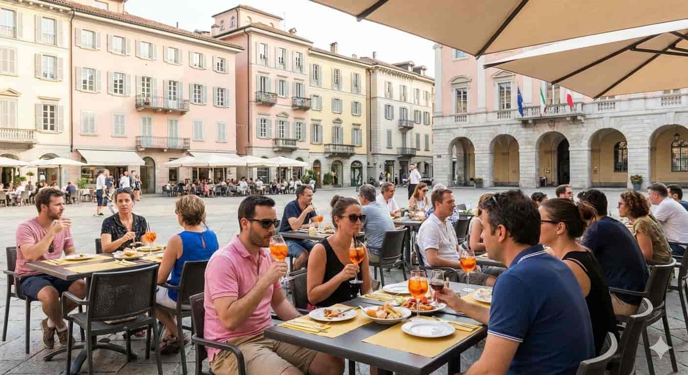 Locals enjoying coffee and conversation at outdoor tables in Piazza della Riforma, Lugano, demonstrating the relaxed Swiss-Italian social culture.